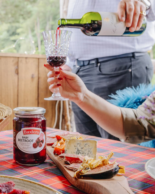 2 people having wine at their picnic