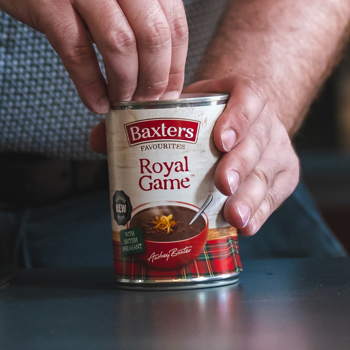 A can of Royal Game Soup being opened